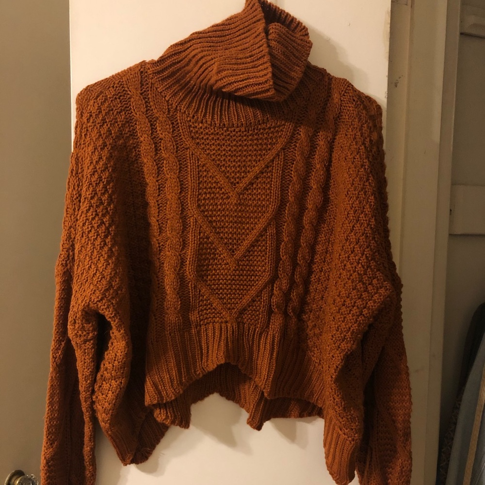 Cableknit turtleneck sweater